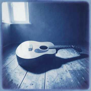 An emotional acoustic ballad with warm guitars and cover